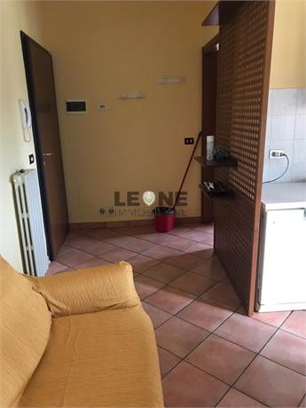 soggiorno con angolo cottura